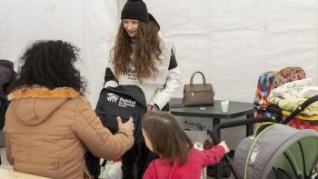 handing out emergency kits to Ukrainian refugees