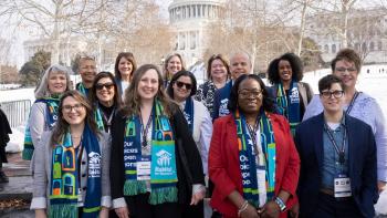 Group photo outside in front of the Capitol building.