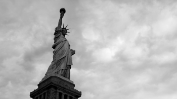 Black and white photo of the Statue of Liberty. 