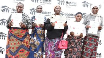Families displaying their titles in Zambia.jpg