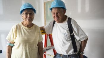 Two elderly volunteers at a Habitat build.