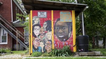 Mural about diversity on a community building.