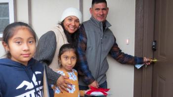 Garcias family opening the door to their home