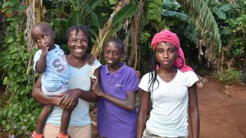 Princile and three of her children in Haiti
