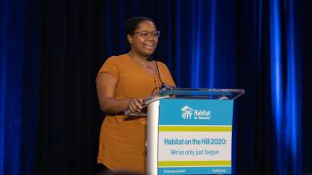 Kirby speaking on stage at Habitat on the Hill