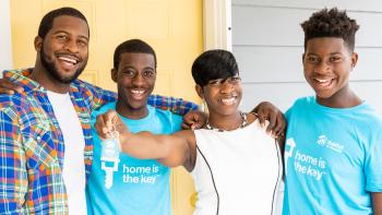 Krushetta embraces her three sons and holds out her house key.