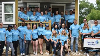 Group of Johnson Controls employee volunteers on Habitat build site