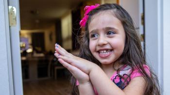 young girl smiling at camera