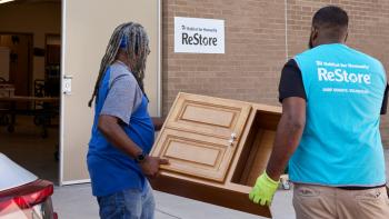 Volunteers unload donations at the Habitat ReStore donation drop-off.