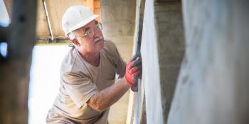 Volunteer working on a wall, Hungary