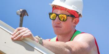 Brian Lafferty hammers on a Habitat build site.