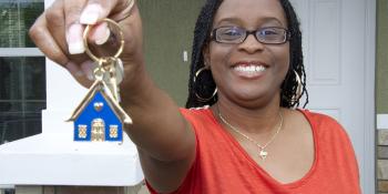 New homeowner holds house keys