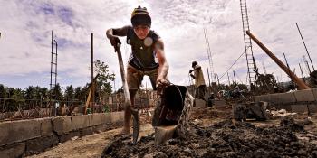 Volunteer build shoveling in the Phillppines