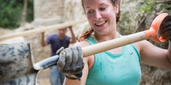 Habitat for Humanity volunteer shovel El Salvador young professional