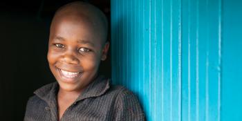 a boy from Kenya smiling
