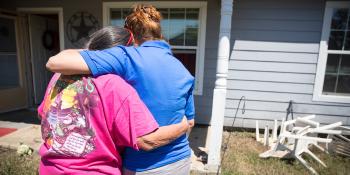 Homeowner stands outside Texas home