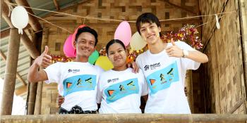 Japanese volunteer Ryota Matsumoto (right) with Habitat homeowners at Asia Build, Myanmar.