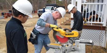 students learn how to use power tools on-site.
