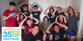 Thomas Lim (front, right) with Project HomeWorks volunteers after cleaning up a home in Singapore.