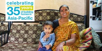 Lata is pictured with her neighbor's son. She was among 100 families who built their homes during 2006 Carter Work Project in Lonavala, India.