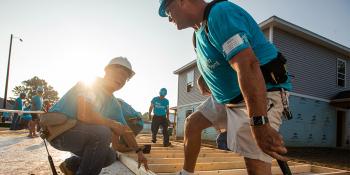 Two Habitat volunteers on the build site. 