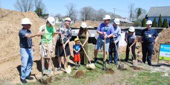 Group of volunteers at groundbreaking.