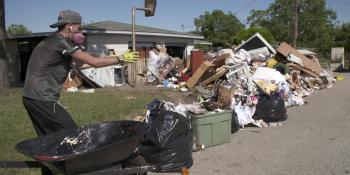 Volunteers in Texas work with Habitat homeowners. 