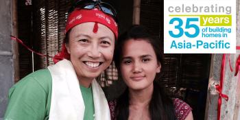 Olivia Wong (left), a long-term Hong Kong volunteer, and a Habitat homeowner's family member in Nepal