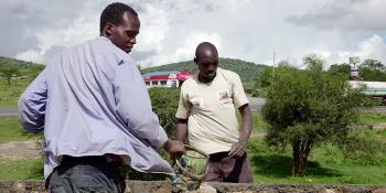 Photo: two man building a wall in Kenya