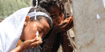 Photo: Children drinking water from a water point in Ethiopia