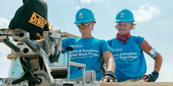 Photo: two volunteers use Stanley Black & Decker tool