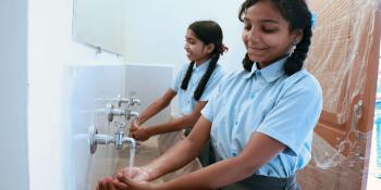 Students in India washing their hands