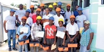 A group of trainees stand together.