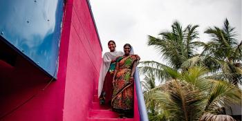 Mahadevi (right) and her daughter Praveena on the steps of her house in southern India