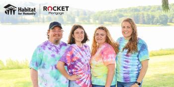 Family of four in tie-dye shirts