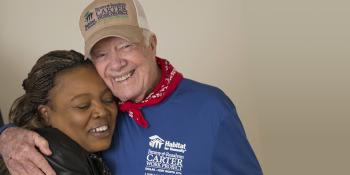 President Carter hugs a volunteer.