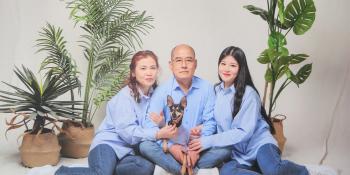 Korean homeowner Jungbae (center) with his wife, younger daughter, and dog