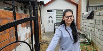 Nada in front of her house in Shuto Orizari, North Macedonia