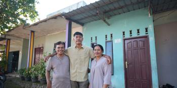 Hendro, son Santo and wife Erta outside their home in Batam, Indonesia