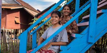 Rem(R) and daughter Sonita outside their home in Siem Reap, Cambodia