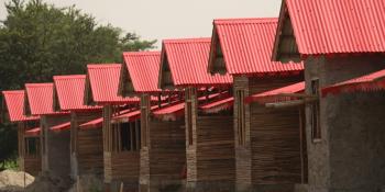 Row of cement bamboo frame homes with red roofs