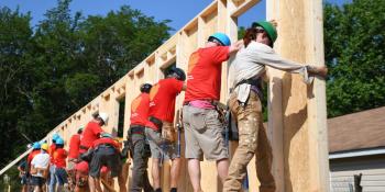 Wells Fargo volunteers working together on a Habitat build site