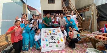 Japanese youth volunteers with future homeowners in Cambodia