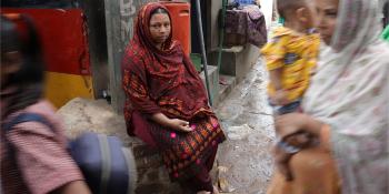DHAKA, BANGLADESH (03/19/2023) - Duaripara informal settlement in Dhaka. Sumi Hasan, 35, poses for a portrait after a rain storm in Duaripara informal settlement.  © Habitat for Humanity International/Raymond McCrea Jones