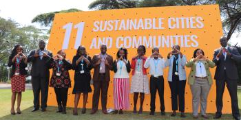 Habitat for Humanity delegation from Africa area office and Habitat for Humanity Kenya showing the house sign at the second session of UN the Habitat Assembly in Nairobi.