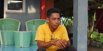 Junaedi at porch of his home in Mauk, Indonesia