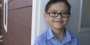Omar in front of his house.