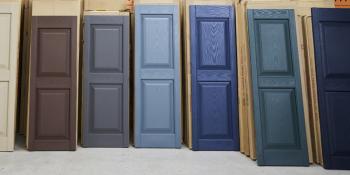Colorful row of donated window shutters