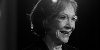 black and white close-up portrait of Rosalynn Carter smiling.