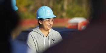 Habitat homeowner wearing hardhat